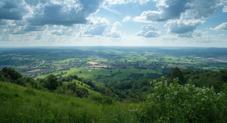 Fototapeta premium Panoramic view of sprawling fields and rich green hills