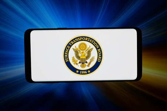 Stuttgart, Germany - 03-19-2026: In this photo illustration, the logo of US agency Surface Transportation Board (STB) is displayed on a smartphone in front of abstract background on computer screen.