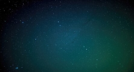 Fototapeta premium night sky glowing with green and blue shining stars