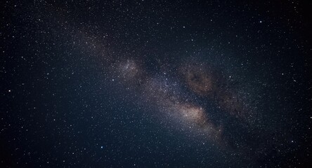 Fototapeta premium Grainy night sky photo capturing the Milky Way with sparkling stars and space dust