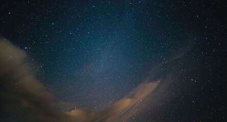 Fototapeta premium astonishing night sky scene displaying shining stars and wispy clouds