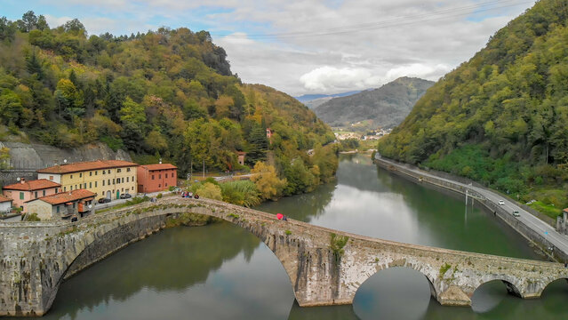 Breathtaking aerial view of Tuscany&rsquo;s Devil&rsquo;s Bridge amidst lush greenery and rivers