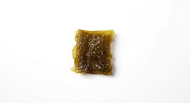 Japanese cuisine kombu kelp featuring brown algae on a smooth white backdrop