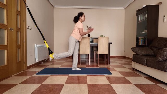 Woman Doing Single Leg Squats at Home for Fitness