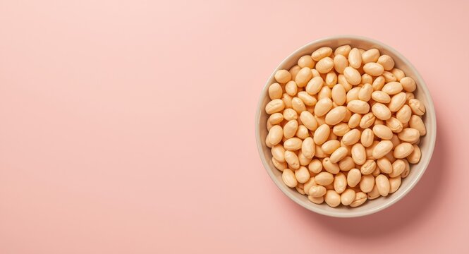 Close-up of butter beans bowl on a soft pastel flat background with copy space