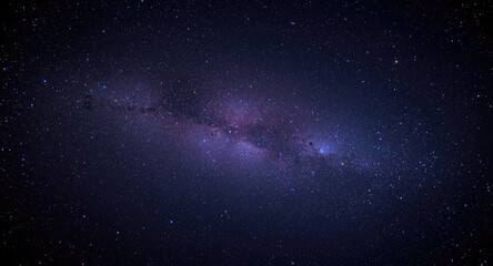 Fototapeta premium Expansive deep space filled with a striking violet and electric blue galaxy studded with stars
