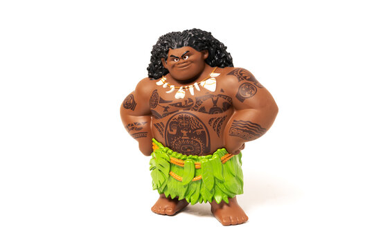 Disney Moana Maui character toy figure with tribal tattoos and grass skirt isolated on white