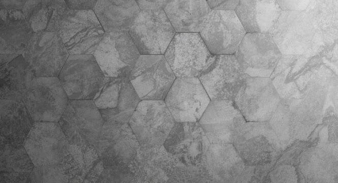 Gray hexagonal floor tile texture with minimal surface detail and diverse shading for an elegant interior design backdrop