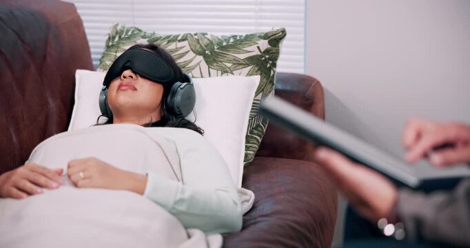 Consultation, therapist and woman with blindfold, headphones and session for recovery or support. Counselor, psychology and patient with sensory depravation for mental health, check up and help