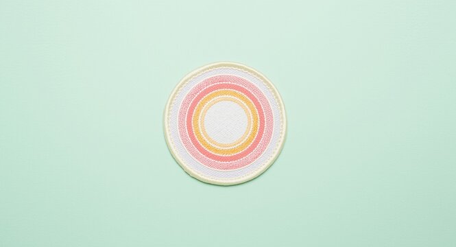 Preventive health contraceptive patch set on a light pastel background with bright circular patterns emphasizing birth control