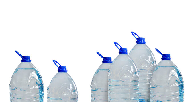 Drinking water bottles, isolated on light blue backdrop. Transparent plastic 5l bottles, full, blue cap. Clean water supply concept. Horizontal studio shot. PNG
