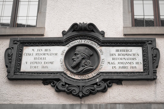 Authentic historic Hus-Haus facade features a memorial plaque for Czech reformer Jan Hus in Konstanz, Germany, ideal for religious history editorials.