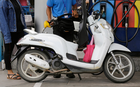 Phnom Penh, Cambodia - June 23, 2022: An attendant refuels a vehicle at a petrol station amid a hike in global gas prices.
