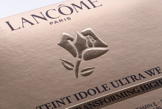 Ukraine, Mykolaiv - February 02, 2026: the logo in the form of a rose and the inscription Lancome Paris on the golden package of Teint Idole Ultra Wear cosmetics