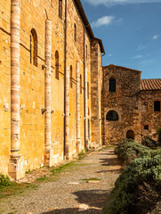 Naklejka premium Ancient stone medieval architecture at Sant'Antimo in Montalcino, Italy.
