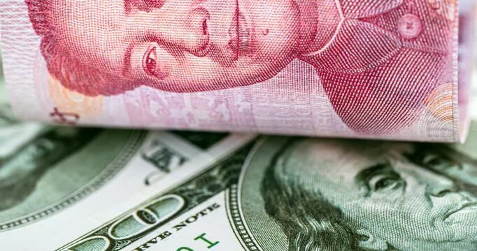100 dollar banknotes with a hundred yuan note (Renminbi), concept of devaluation of the American currency against Chinese money, financial crisis