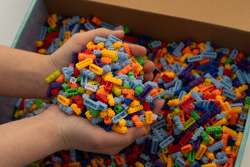 Obraz premium Multi-colored small LEGO construction pieces.