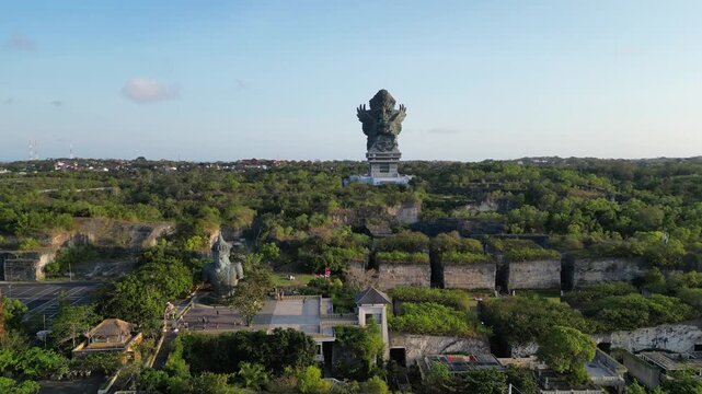 Garuda Wisnu Kencana Aerial view of giant statue atop lush green landscape