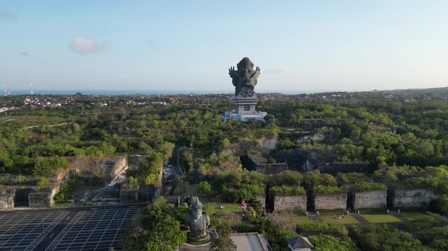 Garuda Wisnu Kencana Aerial view of giant statue atop lush green landscape