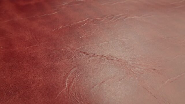 Genuine red leather texture, natural animal skin, luxury vintage cowhide background. Eco friendly leatherette, faux leather. Wallpapere, backdrop, copy space