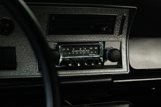 Vintage Chevrolet Opala analog radio and dashboard close up, Classic retro car interior console controls