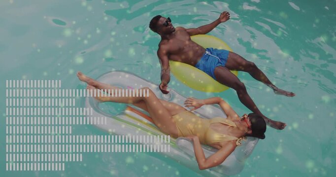 Two people relaxing on pool floats with digital data animation overlay