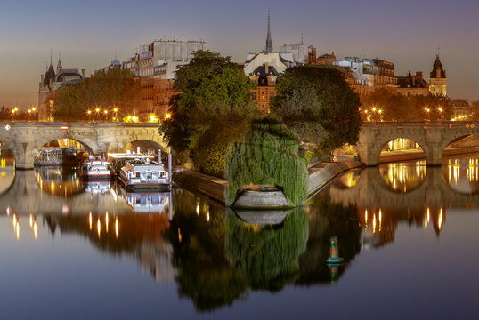 Pont Neuf and Ile de la Cite on Seine River at dusk in Paris, France