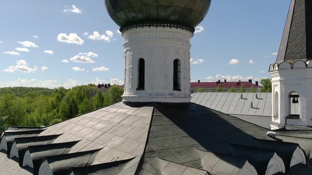 Drone ascending in front of church dome