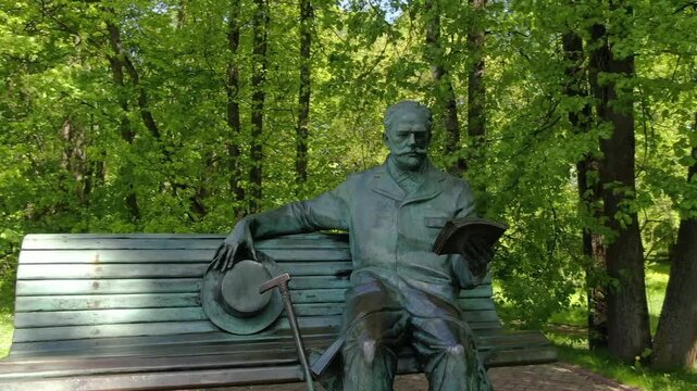 Drone orbiting Tchaikovsky monument in Klin park