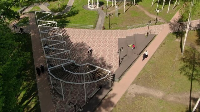 Downward drone move with upward camera tilt