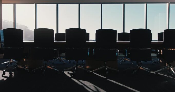 Empty, interior and furniture in office for meeting, corporate training and architecture design. Windows, chairs and modern layout of boardroom, business seminar and luxury table in conference room