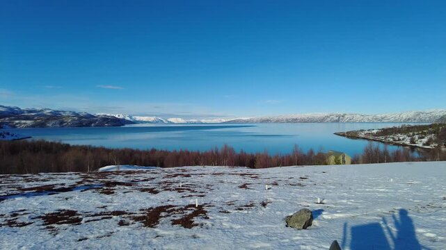 Altafjord with clear blue sky in winter Norwegian sea bay of fjord Alta panorama view video