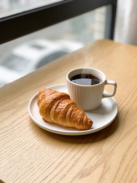 Croissant and hot coffee