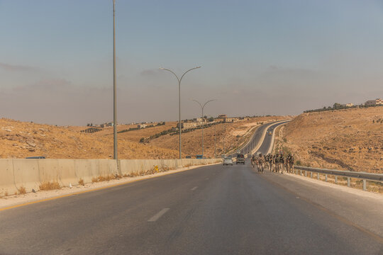IRBID, JORDAN - JULY 17, 2022:  Soldiers marching at Irbid Ring Road, Jordan