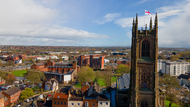 Historic Derby Cathedral tower with Saint George flag in city center