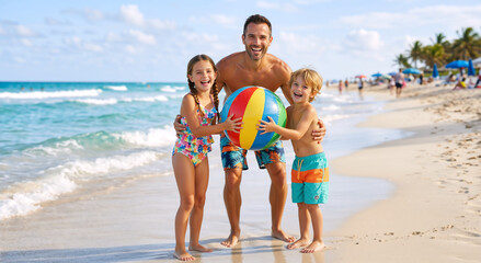 Naklejka premium Happy father with daughter and son holding beach ball on tropical shore. Family having fun on summer vacation by turquoise ocean. Beach games and holiday concept