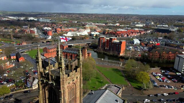 Derby Cathedral tower with flag in historic city center