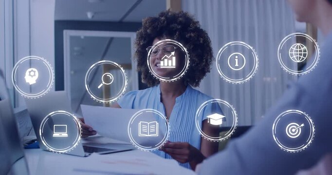 Lifting document woman leading business review, gesturing while data icons forming grid over laptop