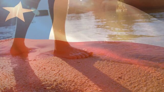 Male shifting weight, pressing toes into wet sand, walking surf for travel, flag overlay drifting