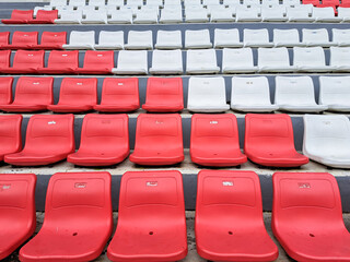 Fototapeta premium Red and white football stadium benches