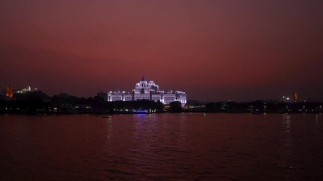 Hussain Sagar lake and Telangana State secretariat building at sunset in India, Time lapse video.
