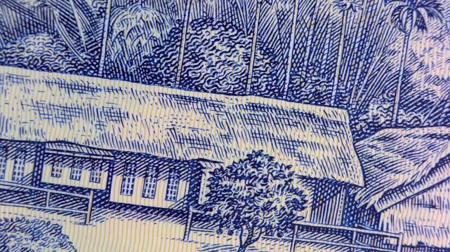 Macro pan of the 500,000 Vietnamese Dong banknote. High-detail view of the Kim Li&ecirc;n Museum (Ho Chi Minh&rsquo;s childhood home), showcasing intricate blue engravings, palm trees, and polymer texture.