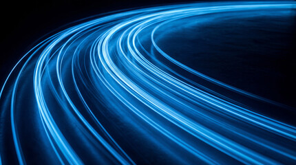 Abstract blue light trails dynamically curving, representing high-speed data flow, digital...