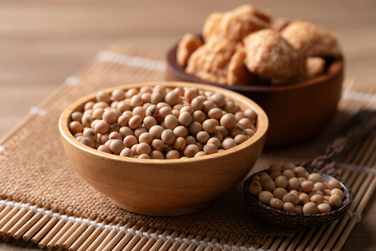 Soybean seeds and raw textured vegetable protein (TVP) soy meat chunks. Healthy plant-based protein, vegan meat substitute made from soy