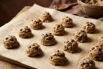 Obraz premium Raw Chocolate Chip Cookie Dough Balls on Parchment Paper