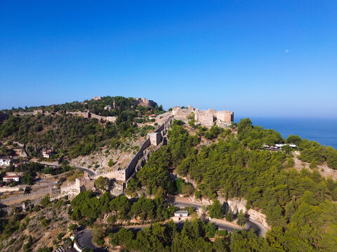 Aerial drone video of Alanya Castle in Antalya, Turkey. Beautiful historic fortress overlooking the Mediterranean Sea, surrounded by coastal landscape and old city architecture. 