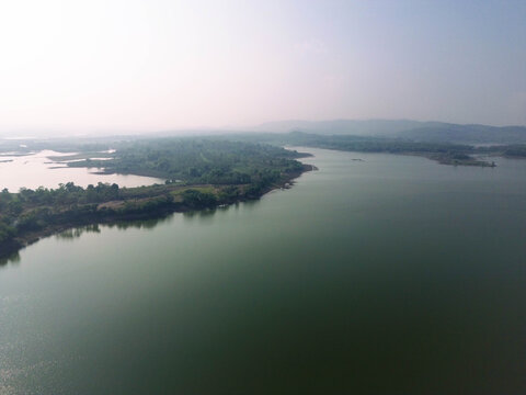 Aerial drone video of Gajah Mungkur Reservoir in Wonogiri, Indonesia. Scenic freshwater reservoir surrounded by green hills and rural landscape, serving as an important water resource for irrigation, 