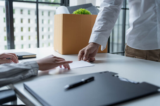 Asian office worker informs HR of resignation