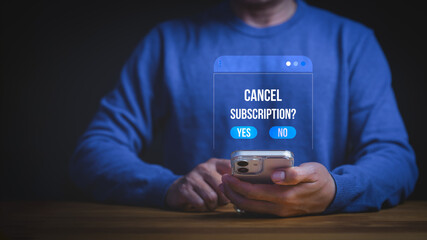 Man using smartphone to cancel subscription on digital app interface. Unsubscribe from online...