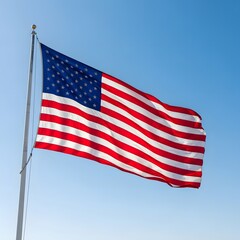 Obraz premium American flag waving against blue sky outdoors